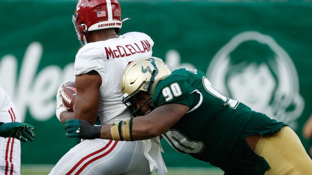 USF linebacker Jhalyn Shuler (17) tackles Alabama running back Roydell Williams (5) during the fourth quarter of last September